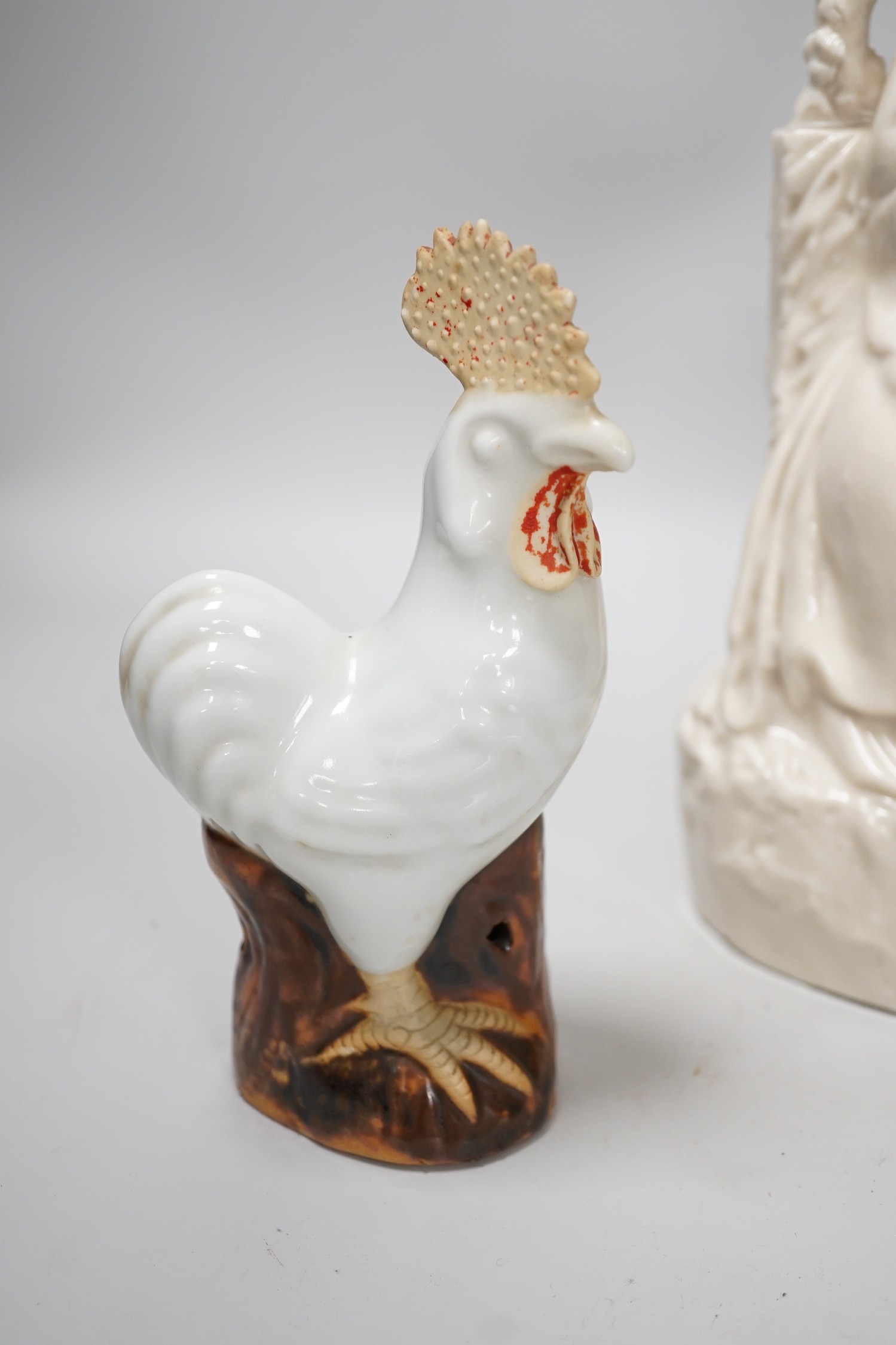A Chinese enamelled blanc de chine figure of Guanyin, together with three other figures. 28cm tall